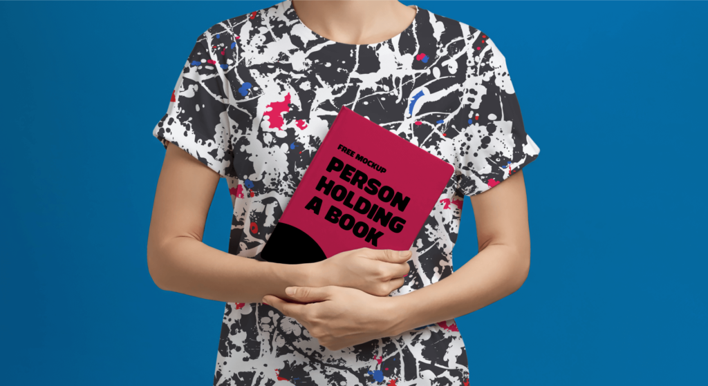 FREE Mockup of a Person Holding a Book