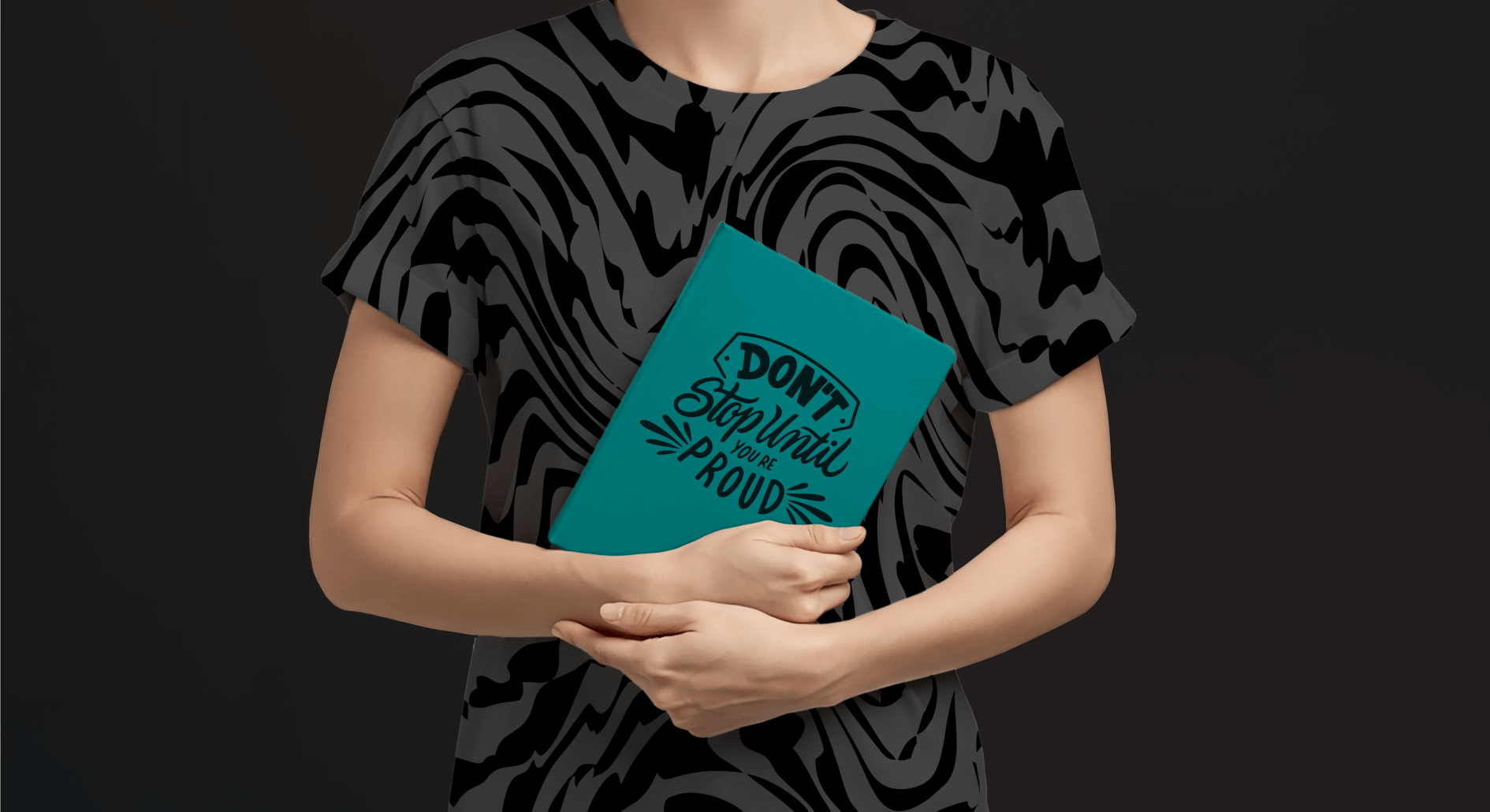 FREE Mockup of a Person Holding a Book
