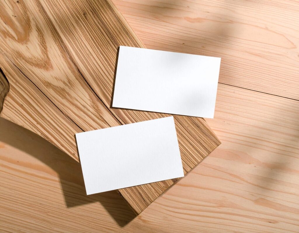 FREE Business Cards Mockup on Wooden Surface
